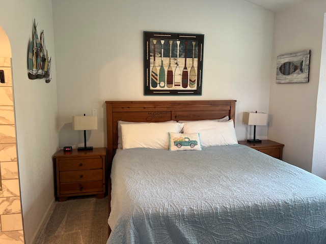 carpeted bedroom with ensuite bathroom