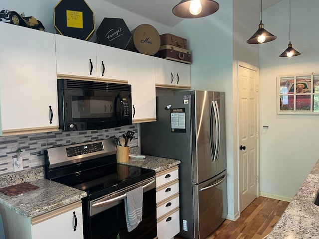 kitchen featuring pendant lighting, appliances with stainless steel finishes, and white cabinetry