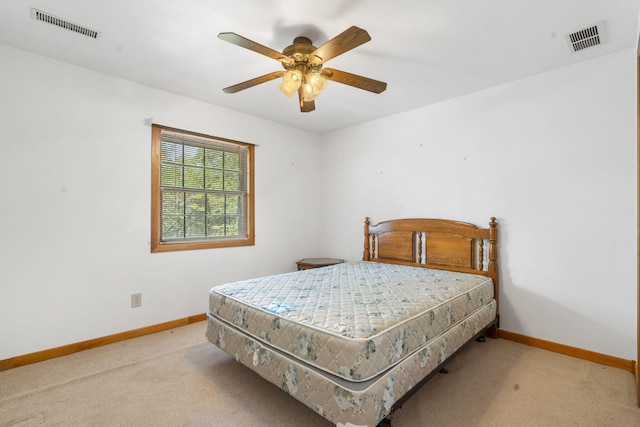 bedroom featuring light carpet and ceiling fan