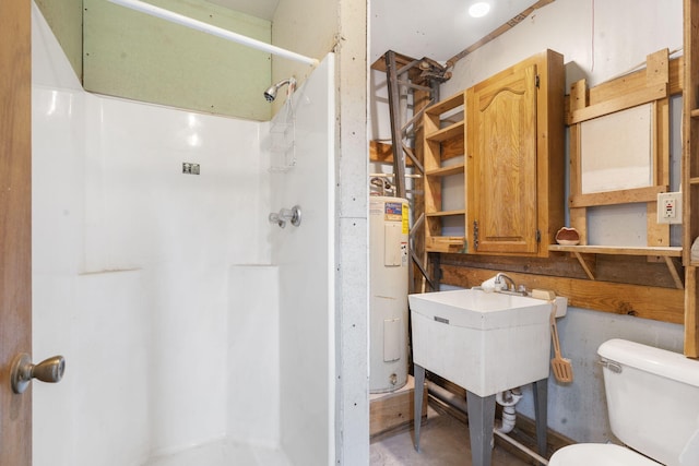 bathroom with electric water heater, a shower, sink, and toilet