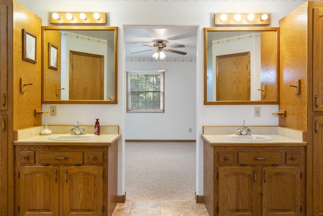 bathroom with tile patterned floors, vanity, and ceiling fan