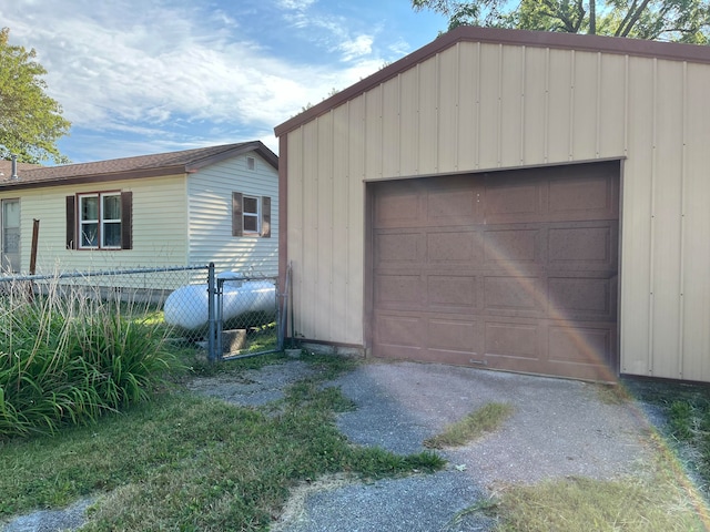 garage featuring wood walls