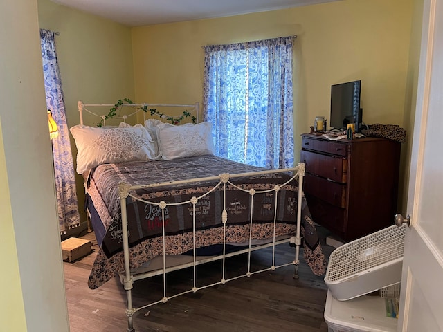 bedroom with wood-type flooring