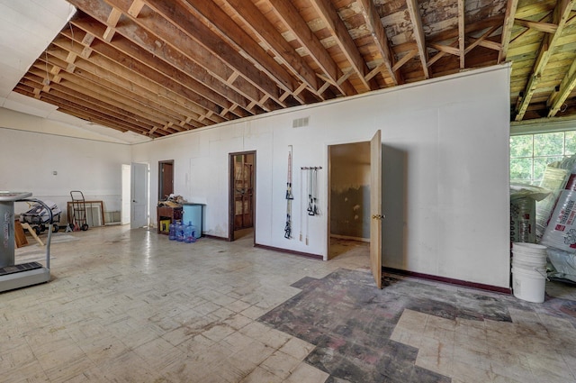 miscellaneous room with visible vents and high vaulted ceiling