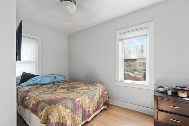 bedroom featuring ceiling fan and light hardwood / wood-style floors