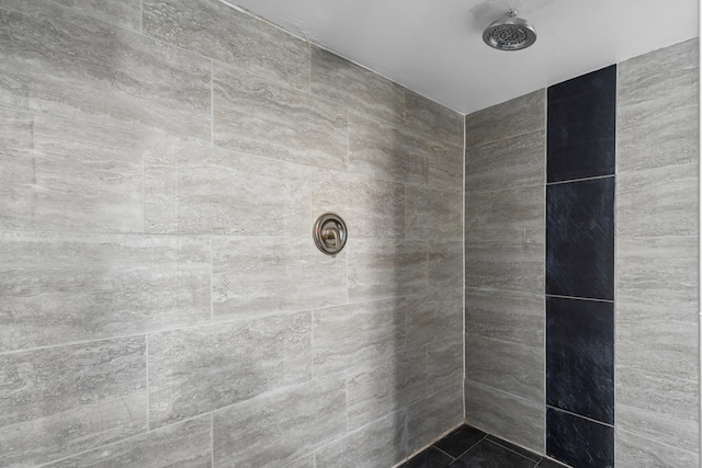 bathroom with tiled shower