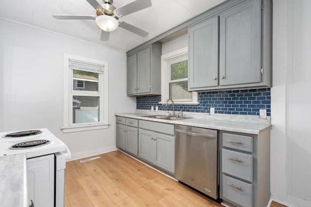 kitchen with light wood-type flooring, stainless steel dishwasher, gray cabinetry, sink, and electric stove