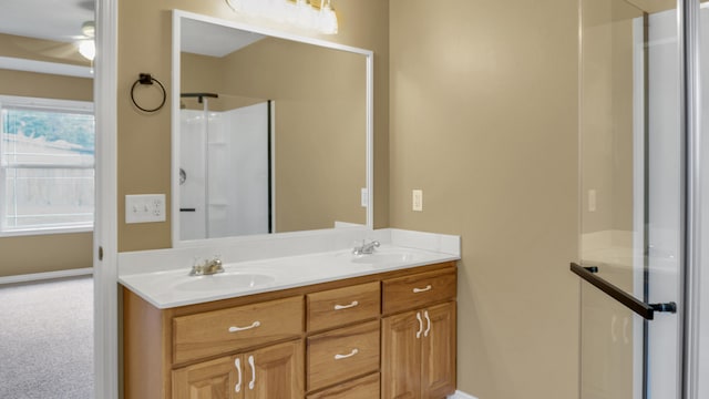 bathroom featuring vanity and a shower