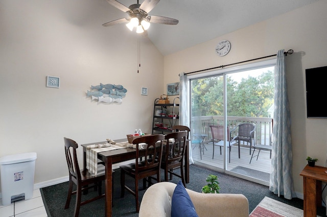 tiled dining area featuring lofted ceiling and ceiling fan