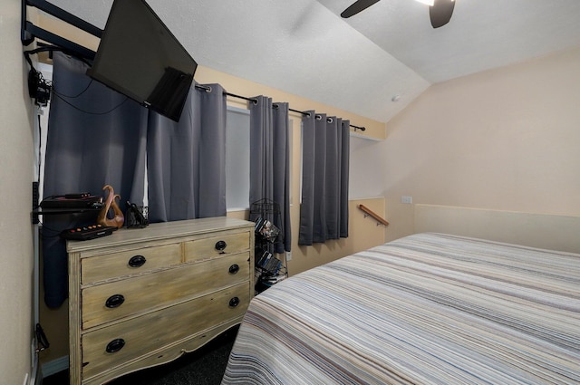 bedroom featuring ceiling fan and vaulted ceiling