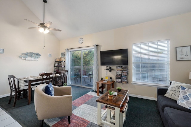 living room with ceiling fan, lofted ceiling, and carpet