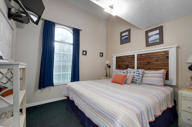 carpeted bedroom with a textured ceiling