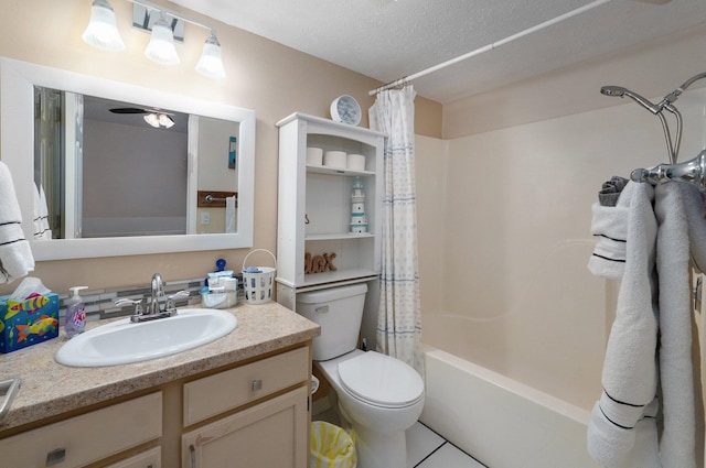 full bathroom featuring toilet, shower / bathtub combination with curtain, tile patterned floors, vanity, and a textured ceiling