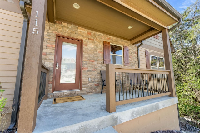 doorway to property featuring covered porch