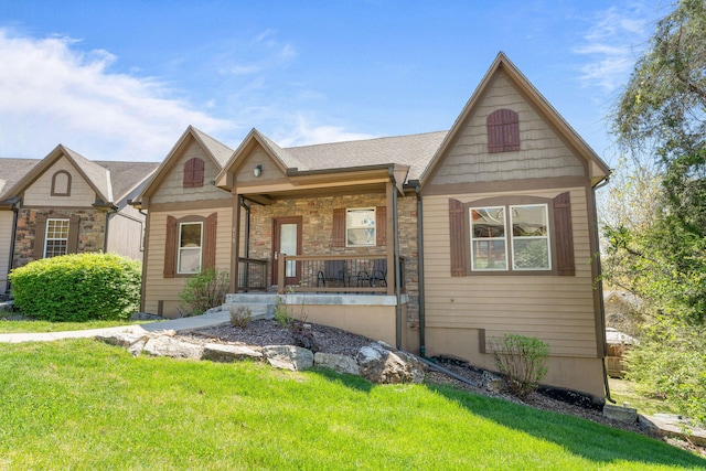 view of front of home with a front lawn and a porch