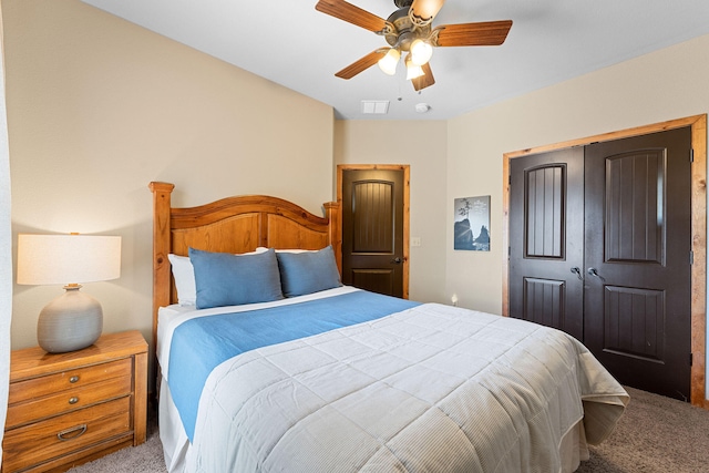 bedroom featuring ceiling fan, carpet floors, and a closet