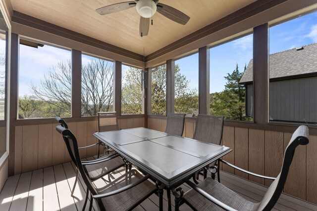 sunroom with ceiling fan and plenty of natural light