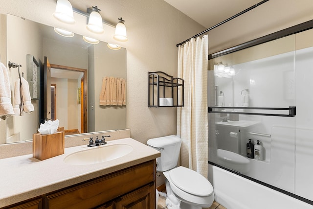 full bathroom with vanity, toilet, and shower / tub combo with curtain