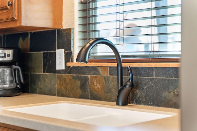 room details with backsplash and sink