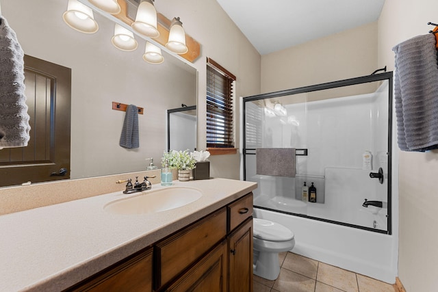 full bathroom with vanity, tile patterned flooring, toilet, and enclosed tub / shower combo