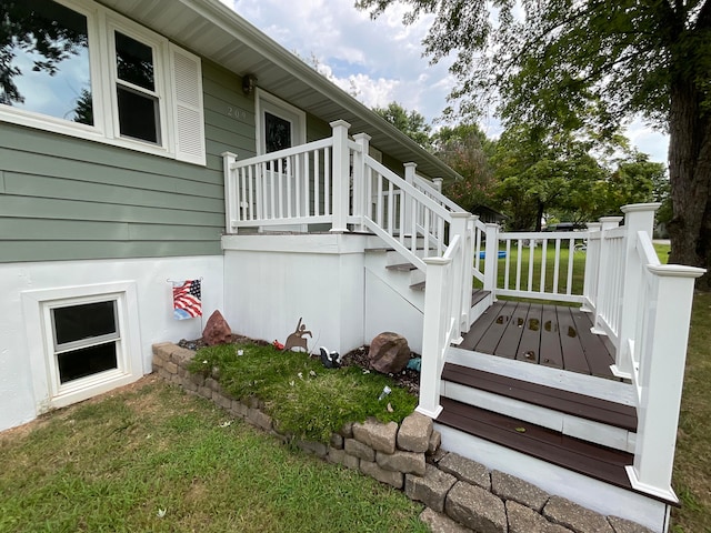 view of home's exterior with a yard and a deck