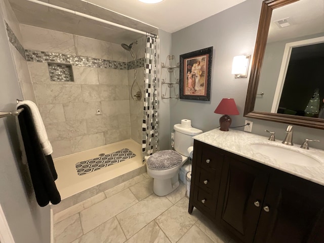 bathroom featuring vanity, toilet, and walk in shower