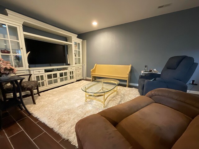 living room featuring dark tile patterned flooring