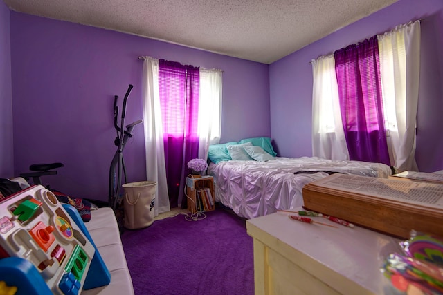 carpeted bedroom with a textured ceiling