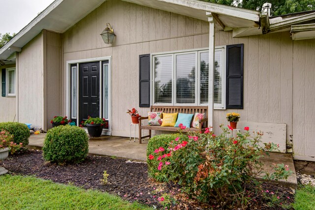 doorway to property with a patio area