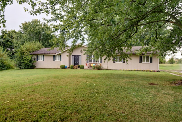 ranch-style home featuring a front yard