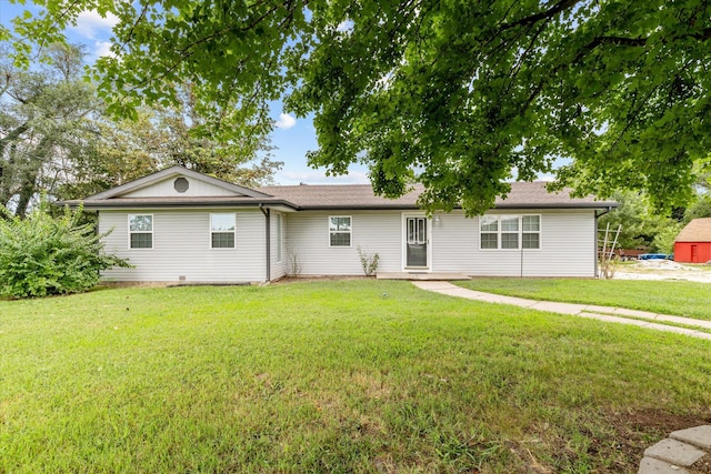 ranch-style home featuring a front yard