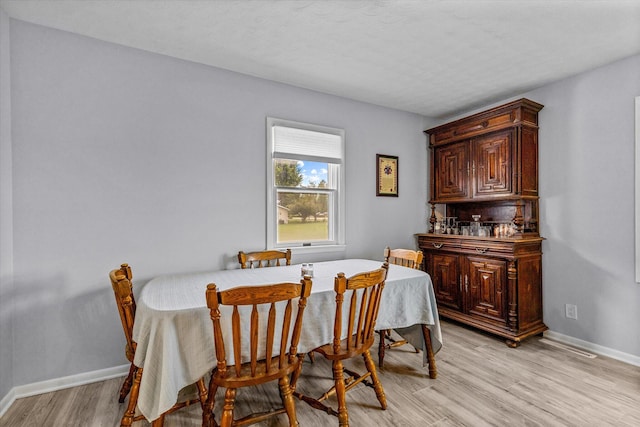 dining room featuring light hardwood / wood-style floors