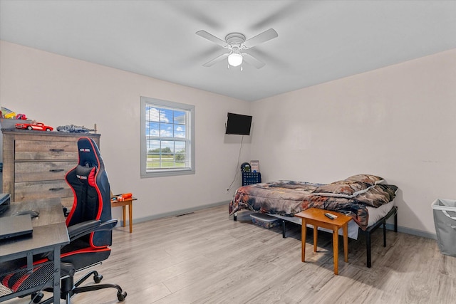 bedroom featuring ceiling fan and light hardwood / wood-style flooring