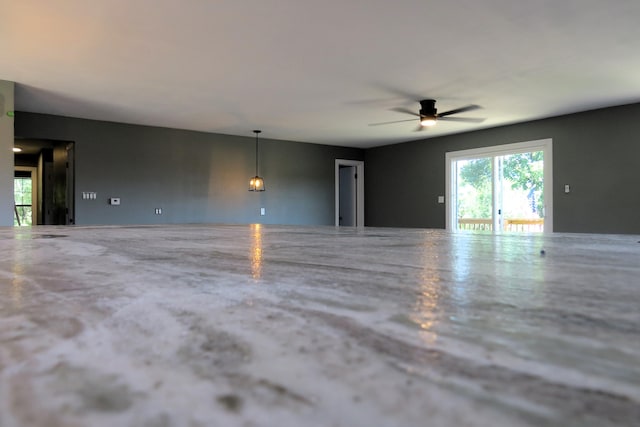 unfurnished room featuring ceiling fan