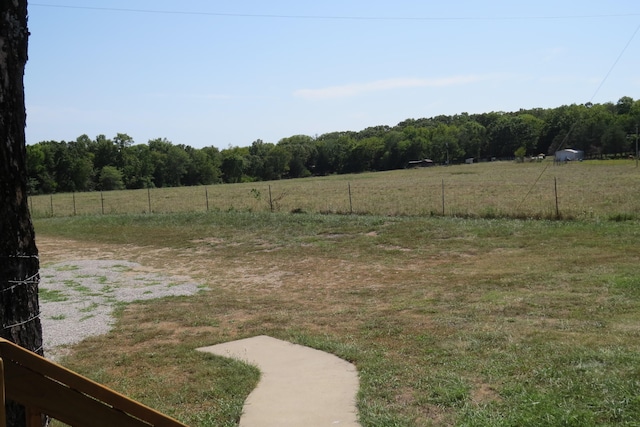 view of yard with a rural view