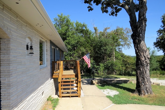 view of yard featuring a wooden deck