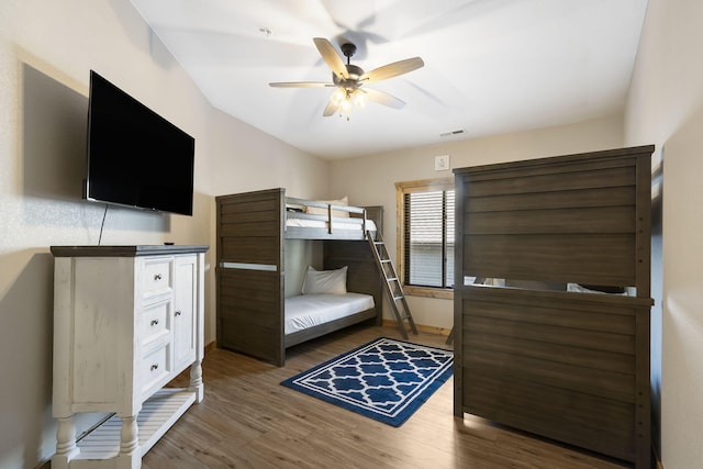 bedroom featuring ceiling fan and dark hardwood / wood-style floors