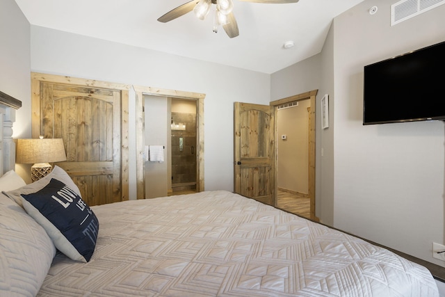 bedroom with ceiling fan and ensuite bath