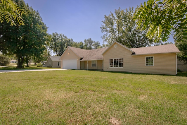 ranch-style home featuring a garage and a front yard