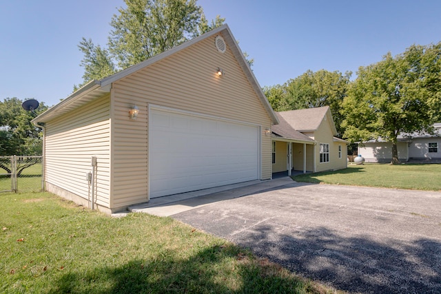 garage featuring a yard