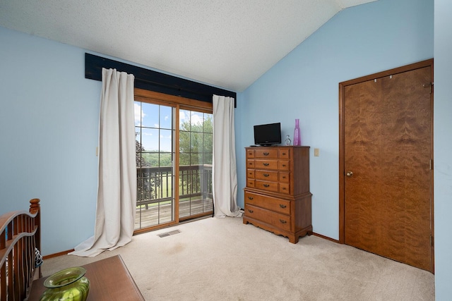 bedroom with access to exterior, vaulted ceiling, baseboards, visible vents, and carpet