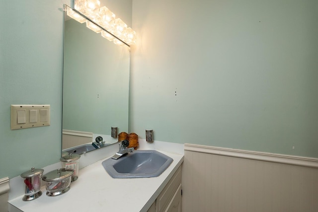 bathroom with vanity and wainscoting