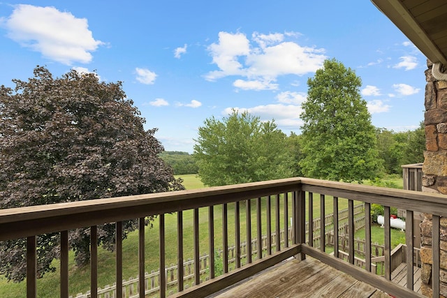 wooden deck with a lawn