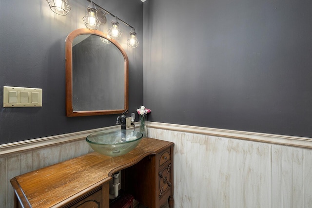 bathroom featuring wainscoting and vanity