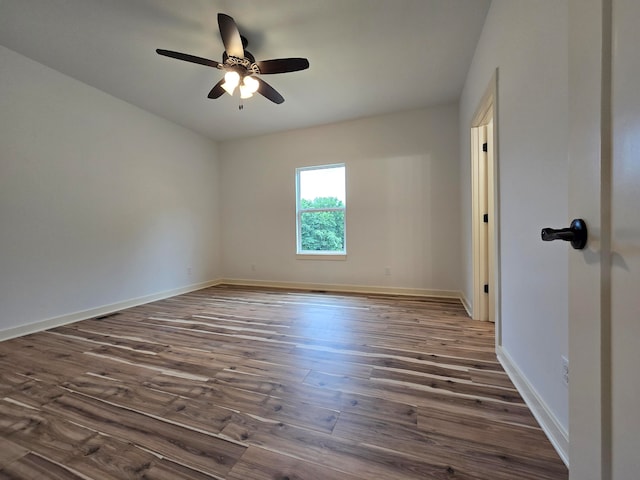 unfurnished room featuring ceiling fan and dark hardwood / wood-style flooring