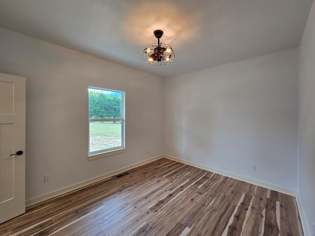 unfurnished room featuring wood-type flooring