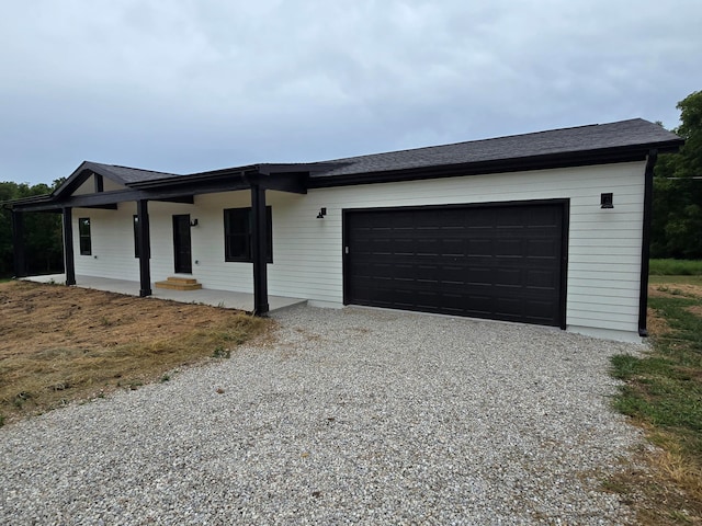 ranch-style house featuring a garage