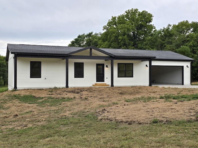 ranch-style house with a front lawn and a garage