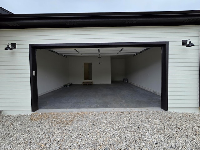 garage featuring wooden walls