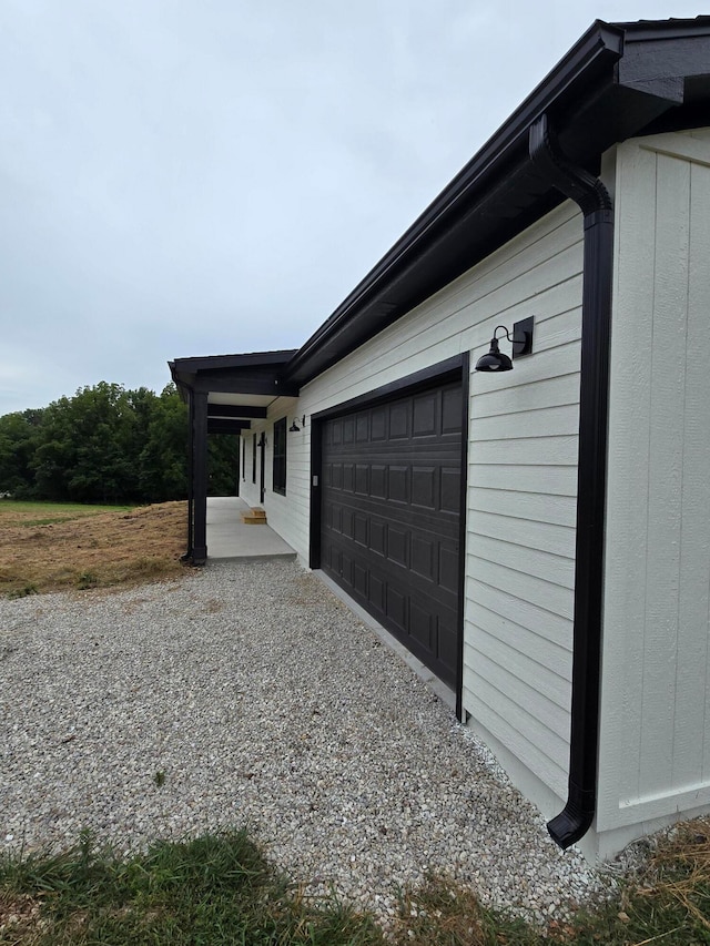 view of side of home with a garage